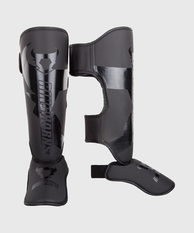 Espinilleras Ringhorns Charger – Negro/Negro