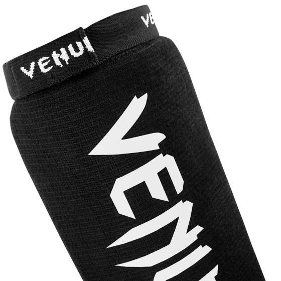 Espinilleras Venum Kontact sin pie – Negro/Blanco