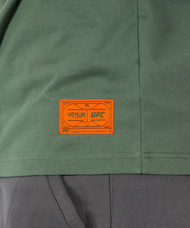 Camiseta Venum UFC Ulti-Man – Caqui Verde/Naranja