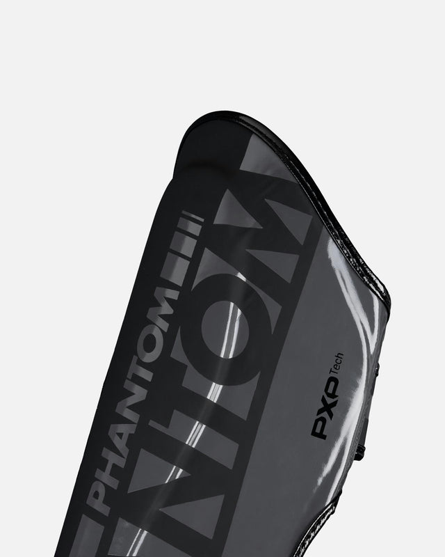 Ochraniacze na piszczele Phantom Athletics APEX Striking – Czarne/Szare