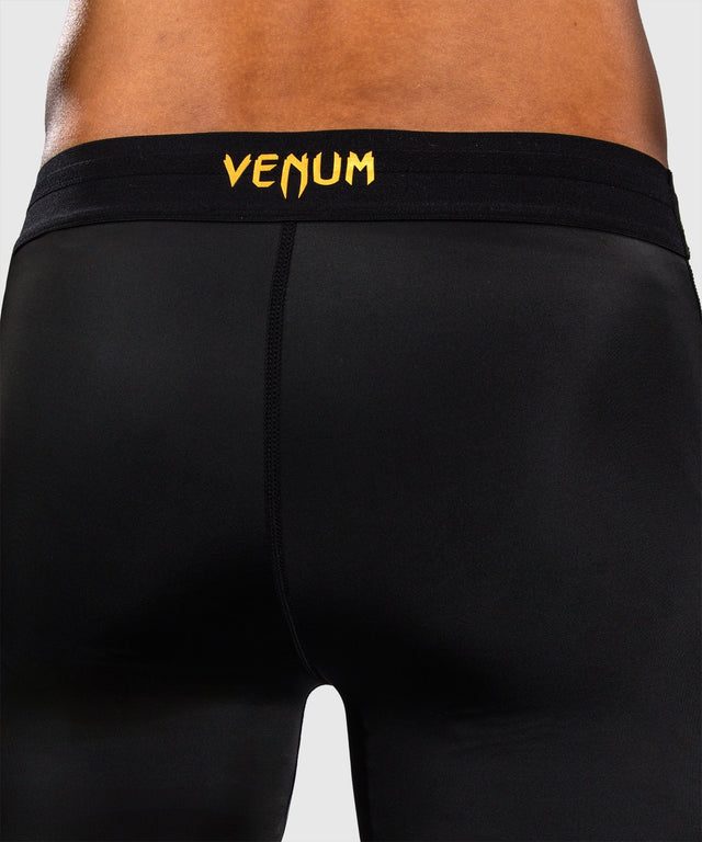 Mallas de compresión Venum G-Core – Negro/Oro