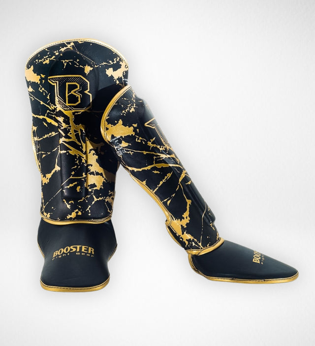 Booster Benskydd Marble Barn - Svart/Guld