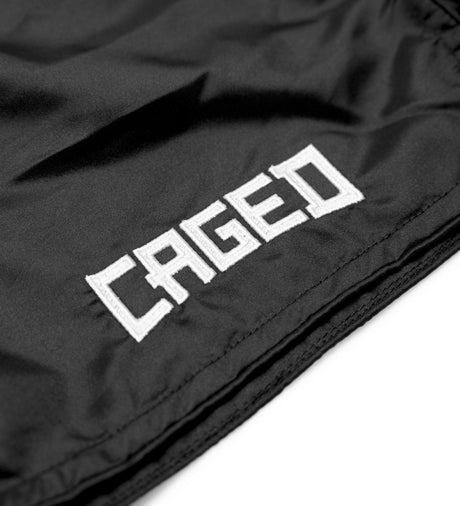 Pantaloncini Muay Thai Caged Classic – Nero/Bianco donna