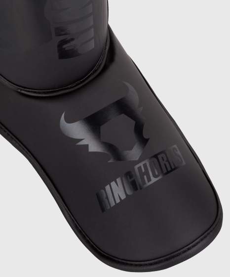 Espinilleras Ringhorns Charger – Negro/Negro