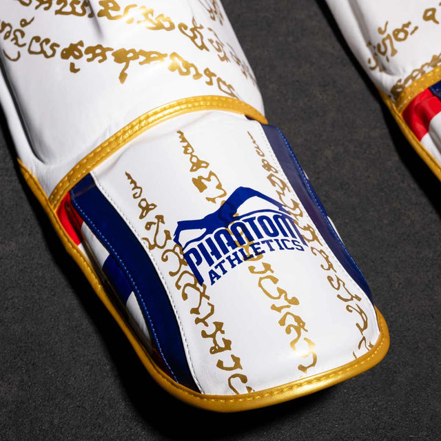 Paratibie Phantom Athletics Muay Thai – Bianco/Oro