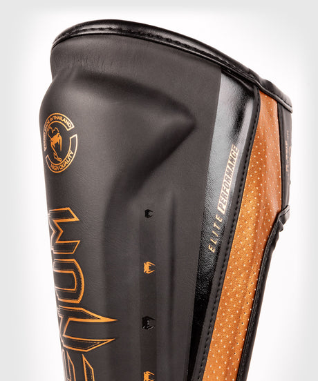 Tibiere Venum Elite Evo – Negru/Bronz