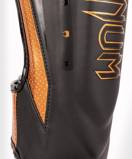 Tibiere Venum Elite Evo – Negru/Bronz