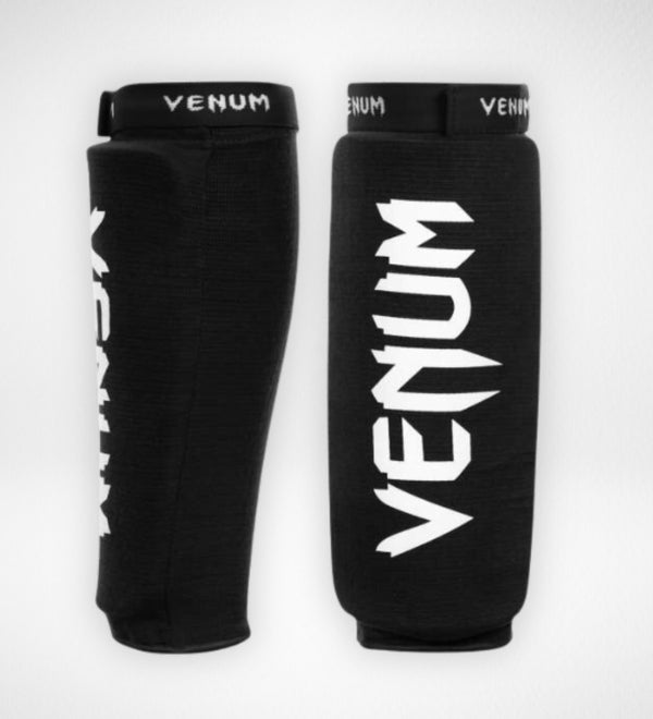 Espinilleras Venum Kontact sin pie – Negro/Blanco