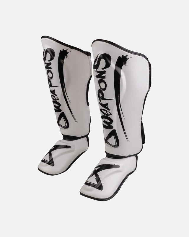 Espinilleras 8 WEAPONS Unlimited 2.0 – Blanco/Negro
