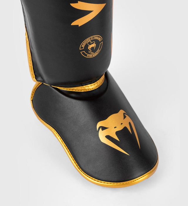 Caneleiras de kickboxing Venum Challenger – Preto/Ouro – Caneleiras