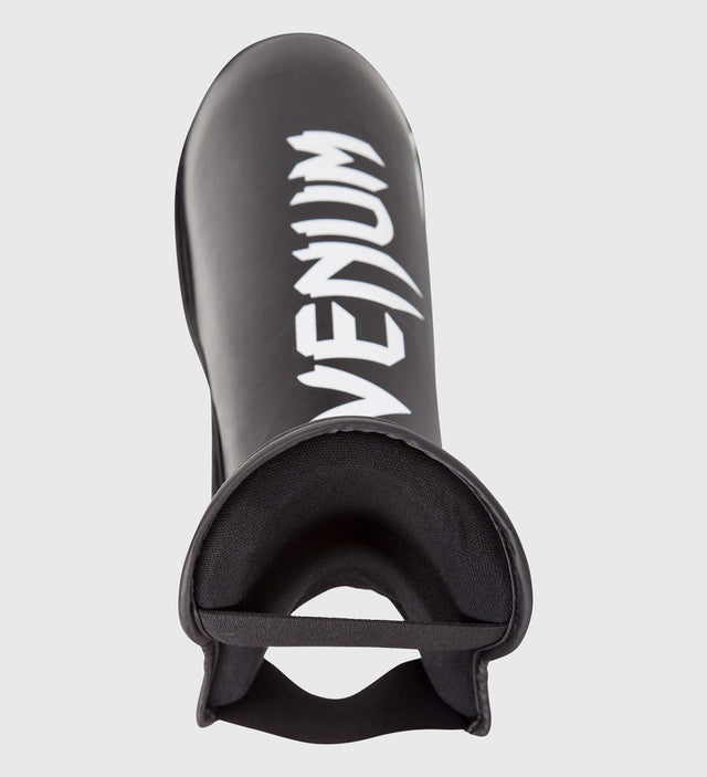Caneleiras de kickboxing Venum Challenger – Preto/Branco – Caneleiras